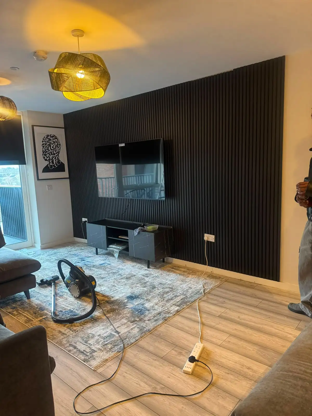 Handyman-installed slat feature wall and TV mount in Dublin